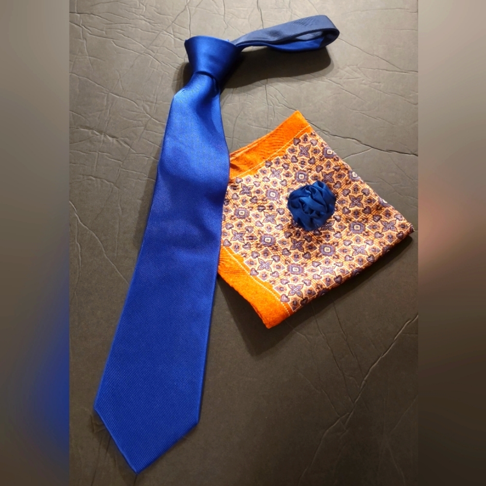 Tie, pocket silk, and lapel pin combo. Excellent condition. Royal blue/orange.